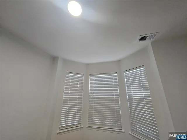 a view of empty room with windows