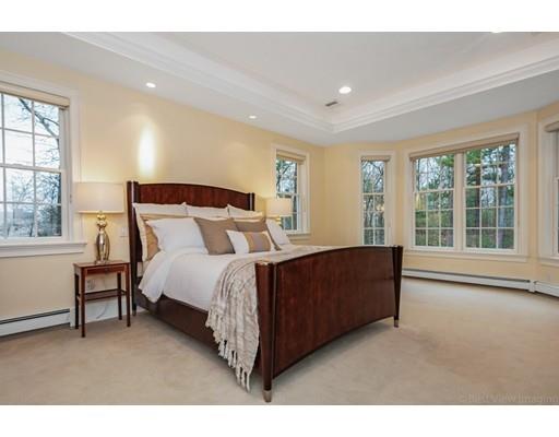 90 Fox Run Road Bolton, MA 01740 - Photo 16 of 30 a spacious bedroom with a bed and a large window