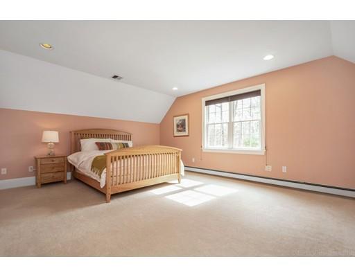 90 Fox Run Road Bolton, MA 01740 - Photo 20 of 30 a bedroom with a bed and window