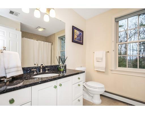 90 Fox Run Road Bolton, MA 01740 - Photo 24 of 30 a bathroom with a granite countertop sink a toilet a mirror and window