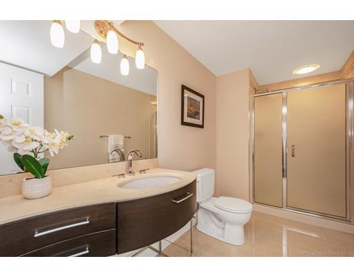 90 Fox Run Road Bolton, MA 01740 - Photo 28 of 30 a bathroom with a sink a toilet and a large mirror