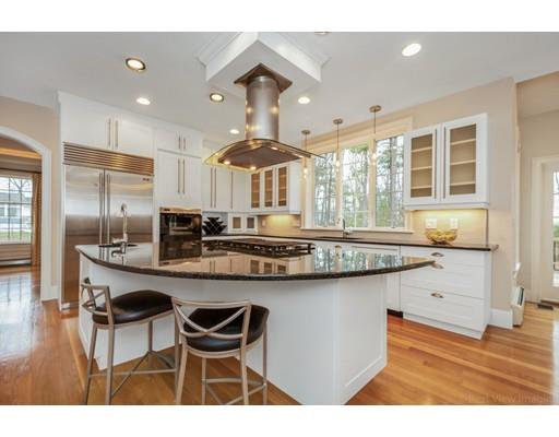 90 Fox Run Road Bolton, MA 01740 - Photo 7 of 30 a kitchen with granite countertop a table chairs stove and refrigerator