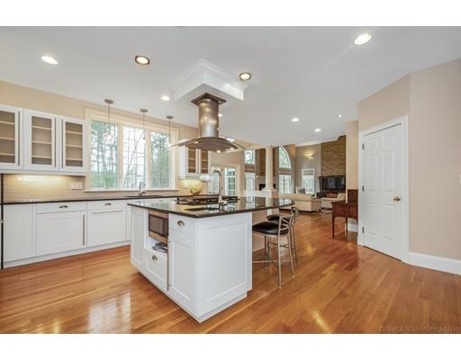90 Fox Run Road Bolton, MA 01740 - Photo 8 of 30 a kitchen with stainless steel appliances granite countertop a stove and a refrigerator