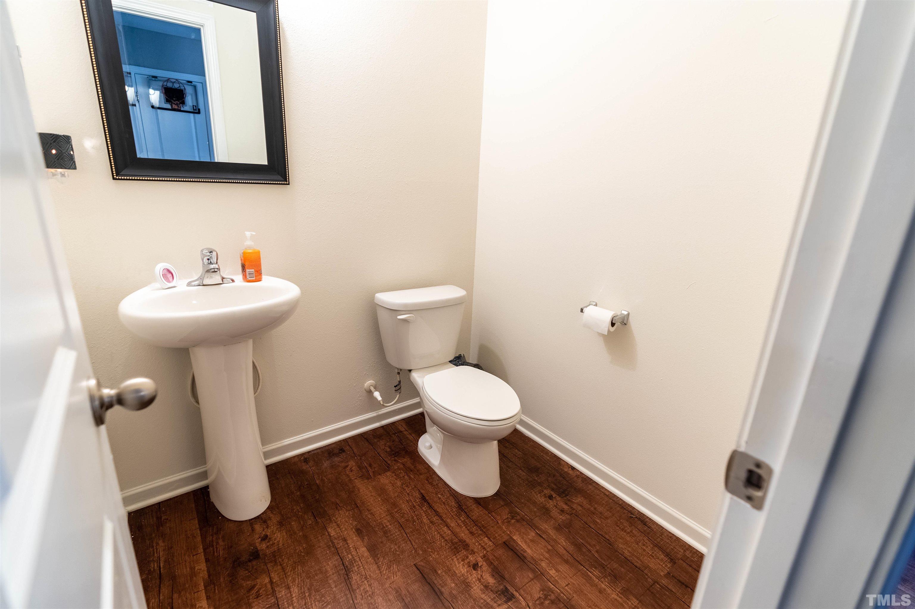 1848 Greenbrook Trail Dallas, NC 28034 - Photo 11 of 19 a bathroom with a toilet sink and mirror