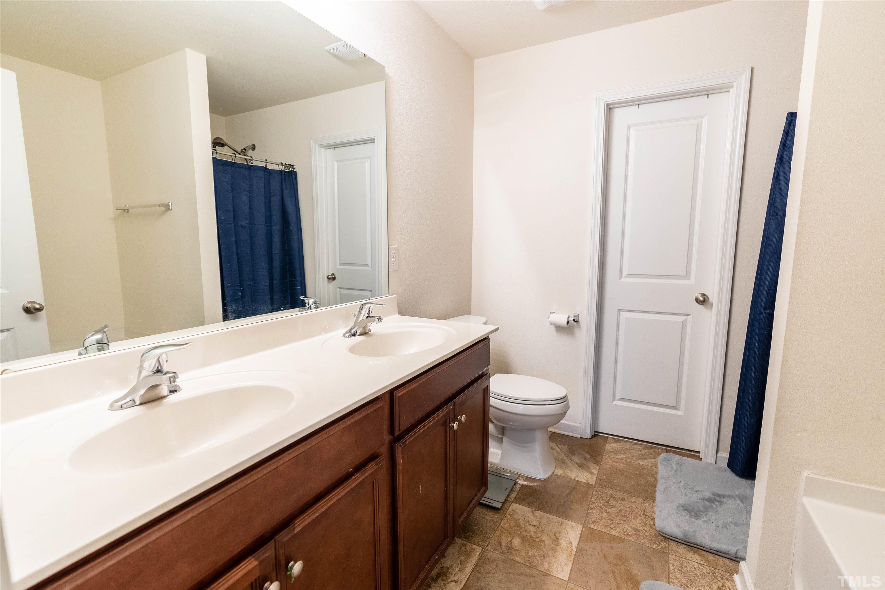 1848 Greenbrook Trail Dallas, NC 28034 - Photo 13 of 19 a bathroom with a double vanity sink toilet and shower