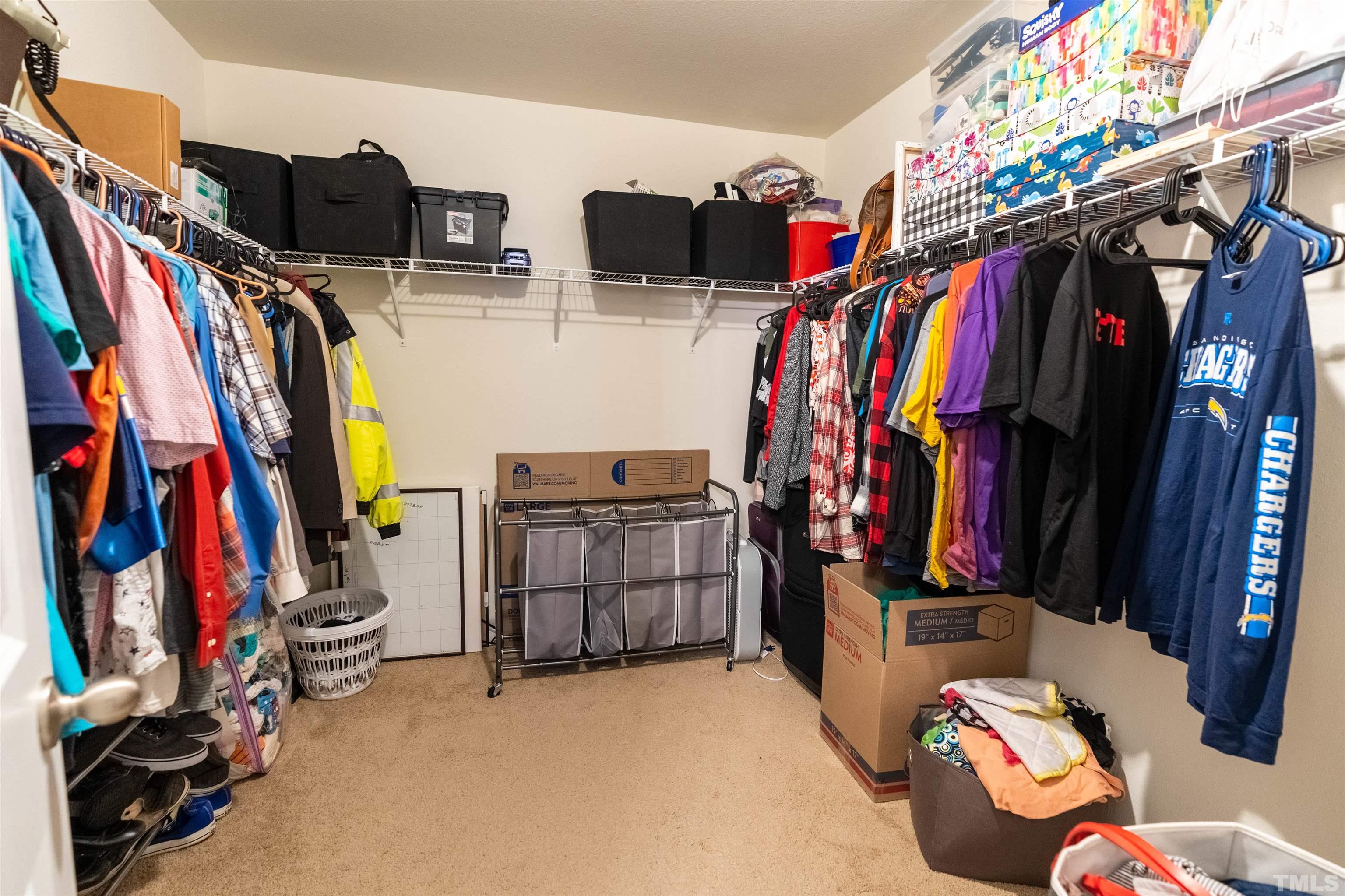 1848 Greenbrook Trail Dallas, NC 28034 - Photo 14 of 19 a view of walk in closet with clothes and shoes