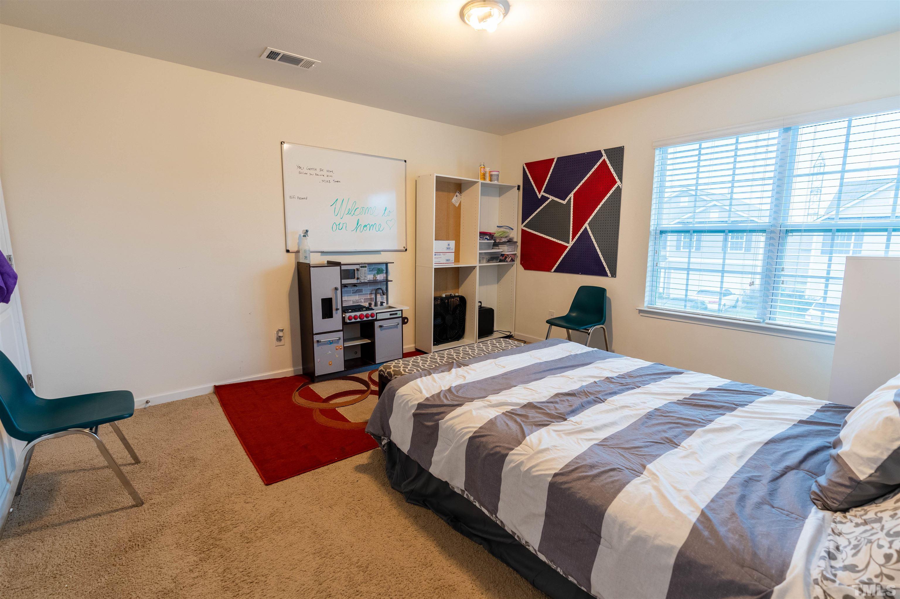 1848 Greenbrook Trail Dallas, NC 28034 - Photo 16 of 19 a bedroom with a bed and a closet