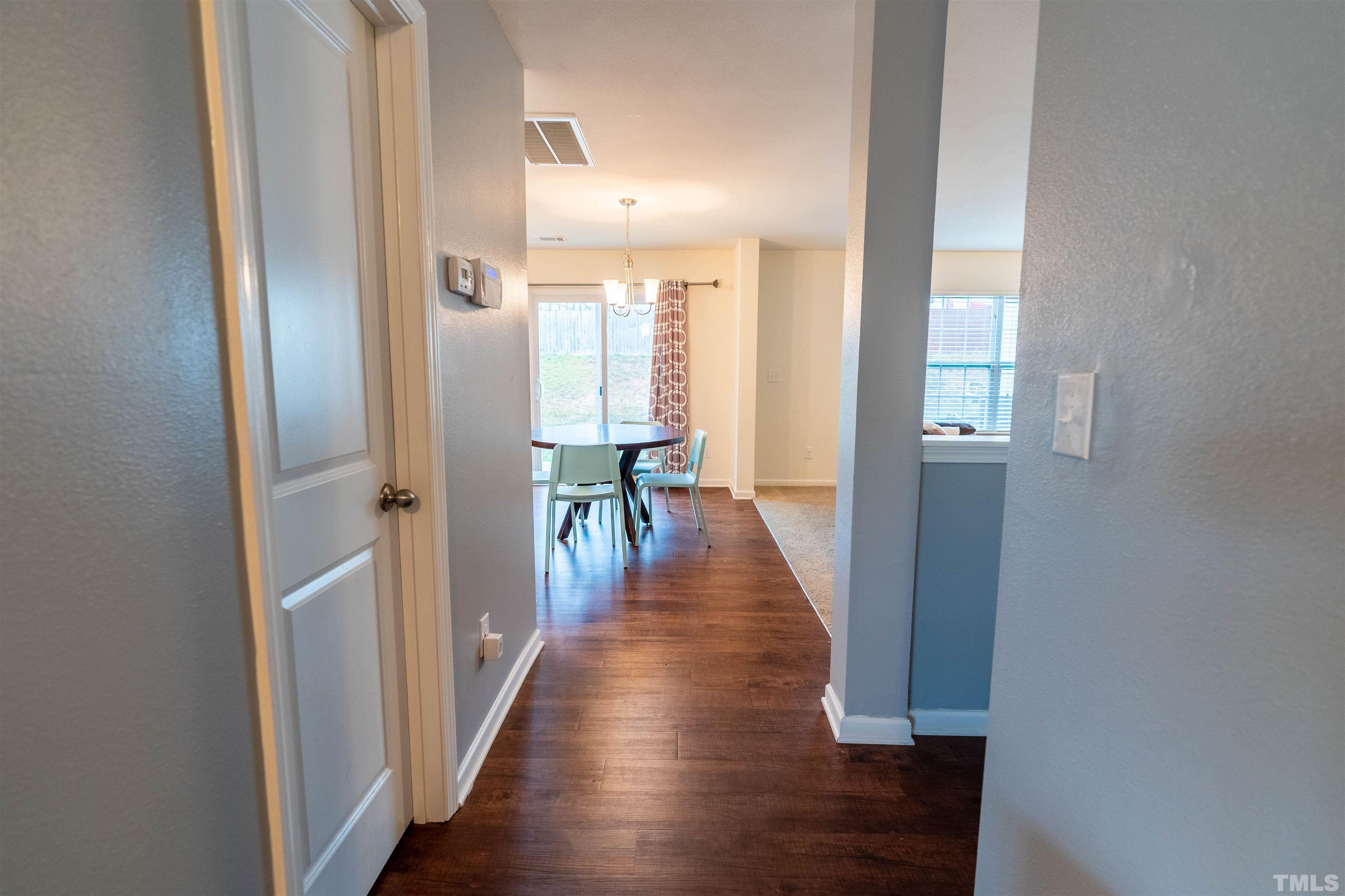 1848 Greenbrook Trail Dallas, NC 28034 - Photo 6 of 19 a view of a hallway with wooden floor and staircase