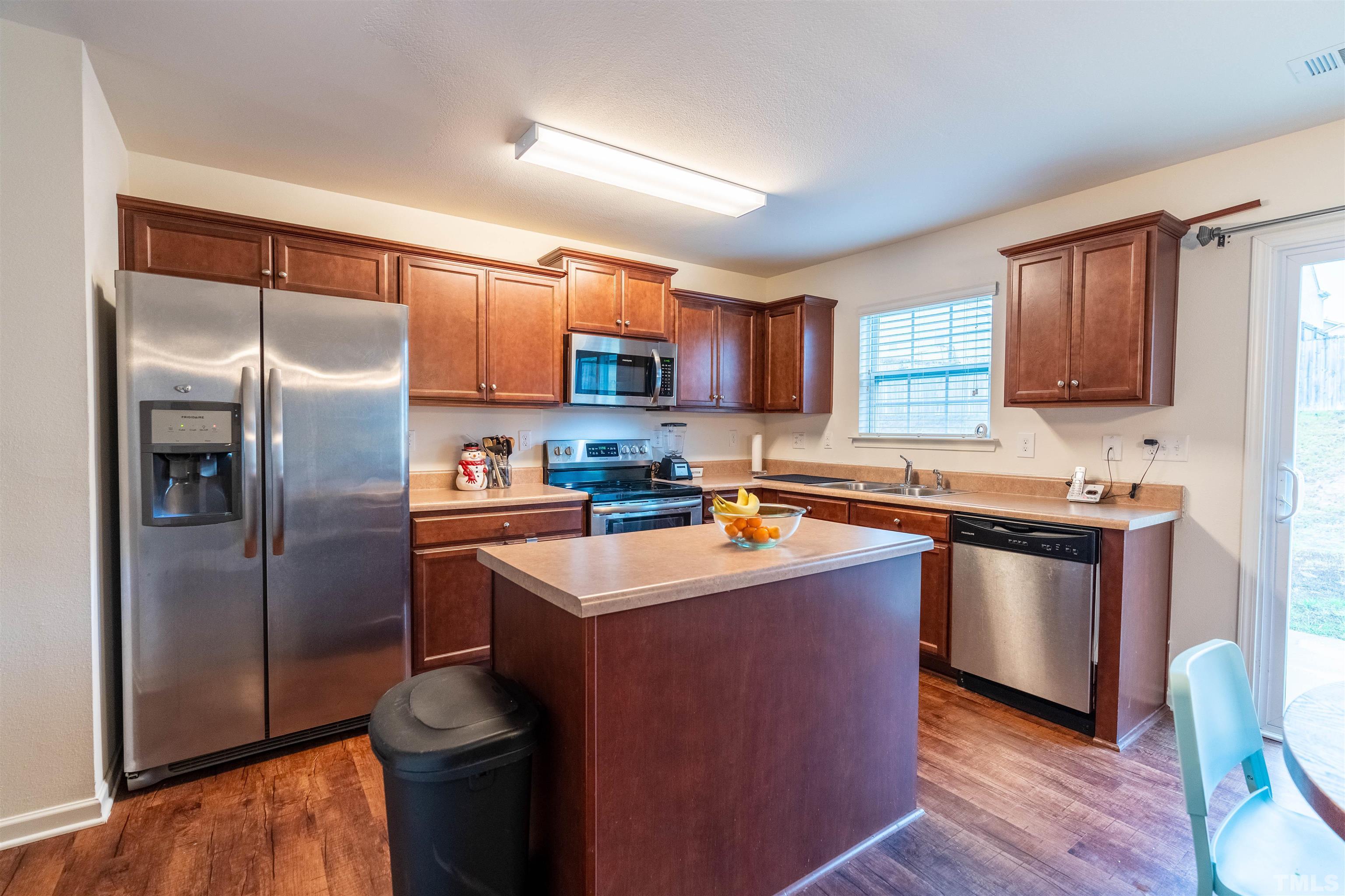 1848 Greenbrook Trail Dallas, NC 28034 - Photo 7 of 19 a kitchen with stainless steel appliances granite countertop a refrigerator a sink a stove a microwave and island