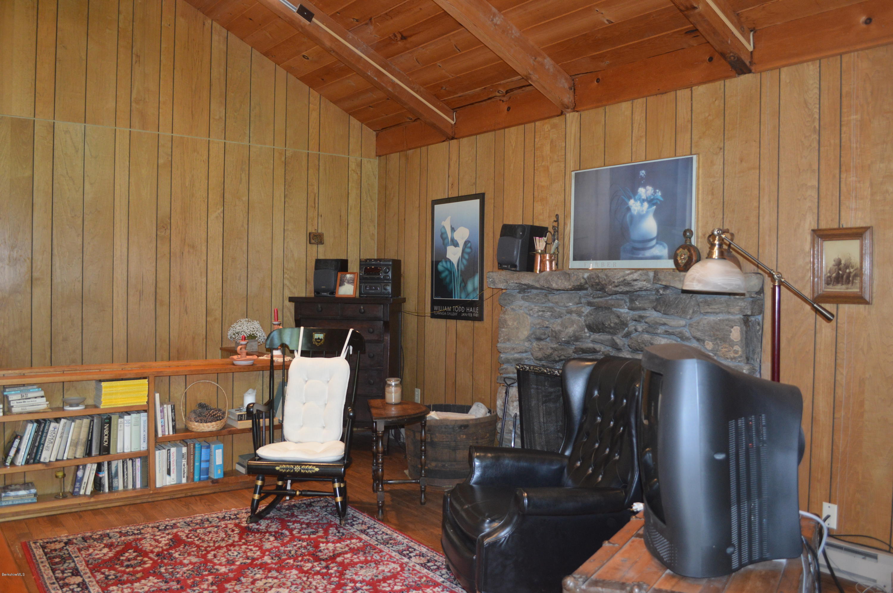9 Mcdarby Road Tyringham, MA 01238 - Photo 4 of 15 a living room with furniture and a fireplace