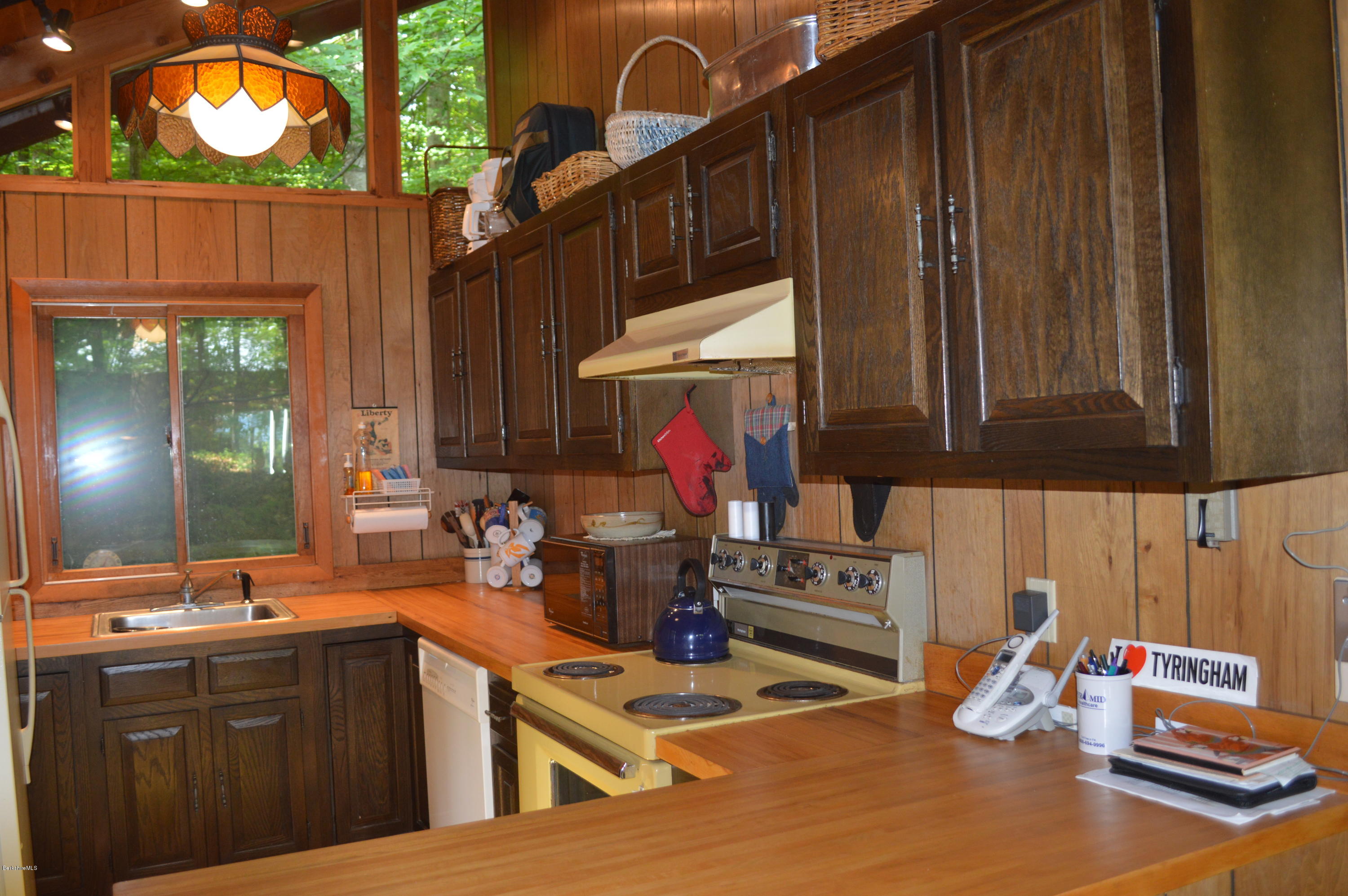 9 Mcdarby Road Tyringham, MA 01238 - Photo 5 of 15 a kitchen with a sink and cabinets