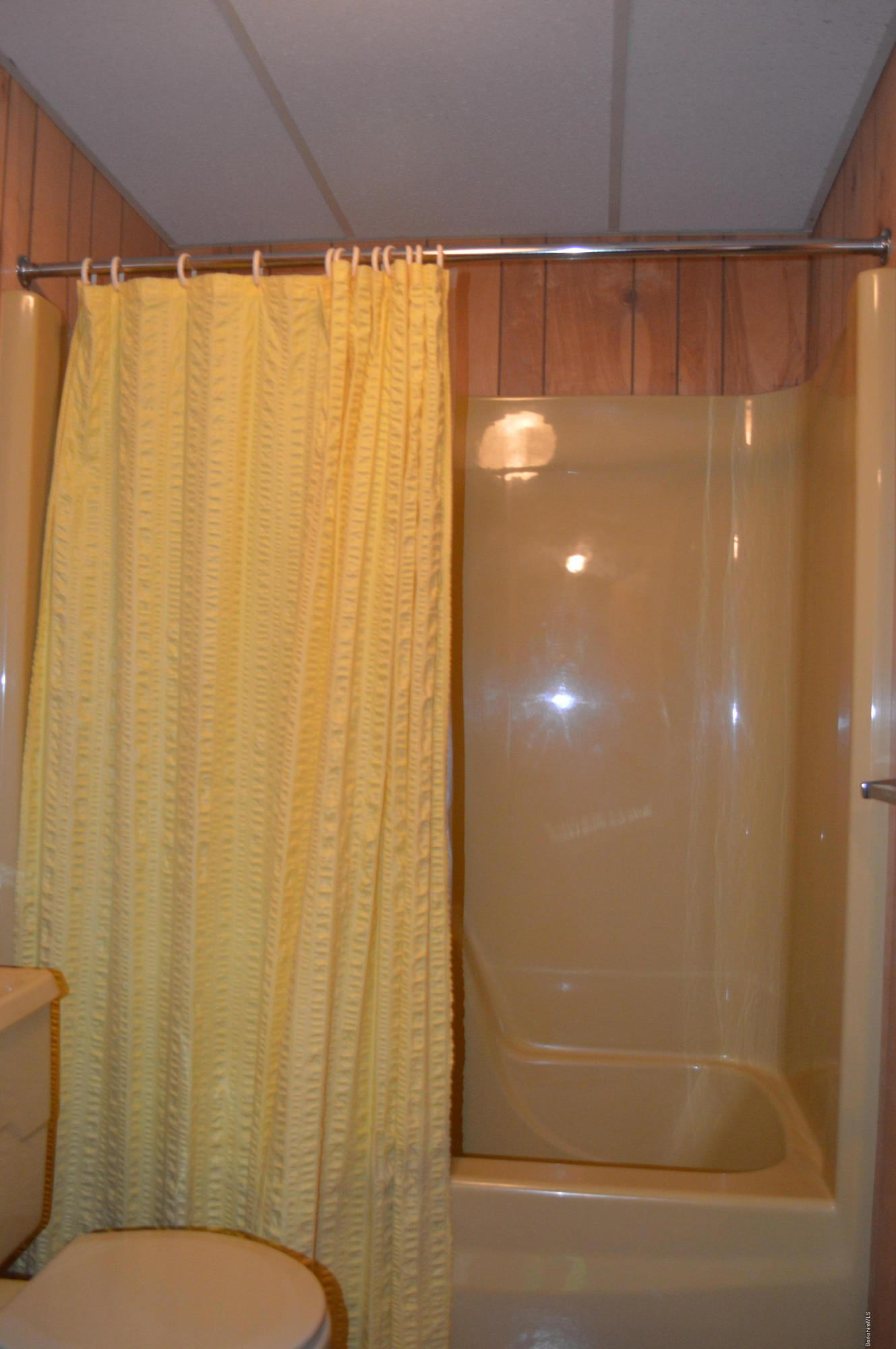 9 Mcdarby Road Tyringham, MA 01238 - Photo 9 of 15 a bathroom with a shower curtain and sink