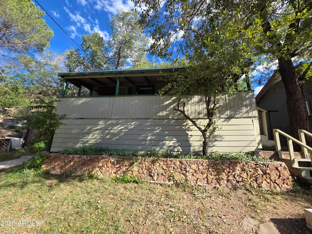 a view of a bench in a back yard