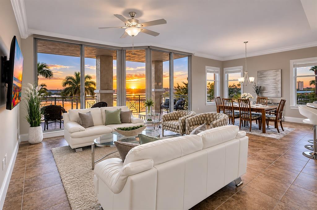 140 Riviera Dunes Way, Unit 206 Palmetto, FL 34221 - Photo 1 of 46 a living room with furniture dining table and a large window