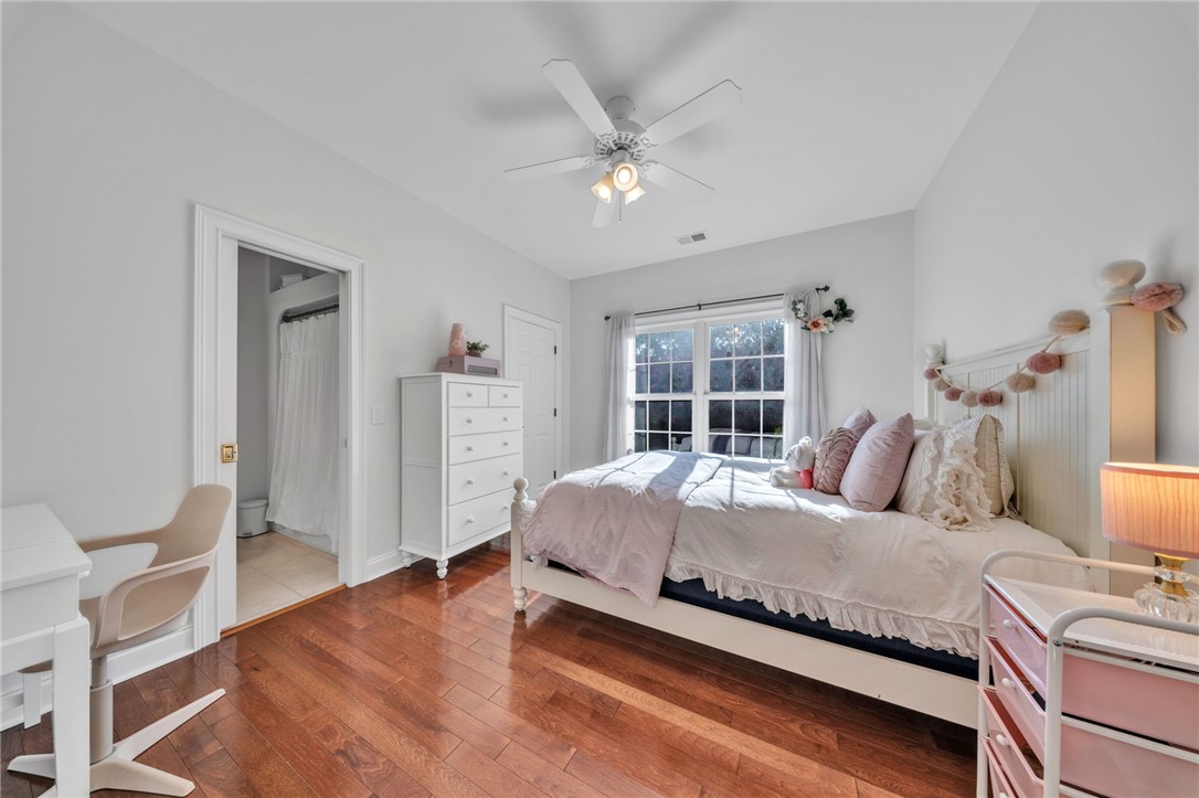 102 Country Walk Lane Clemson, SC 29631 - Photo 28 of 39 Hardwood floors and a crisp color palette elevate this restful bedroom retreat.