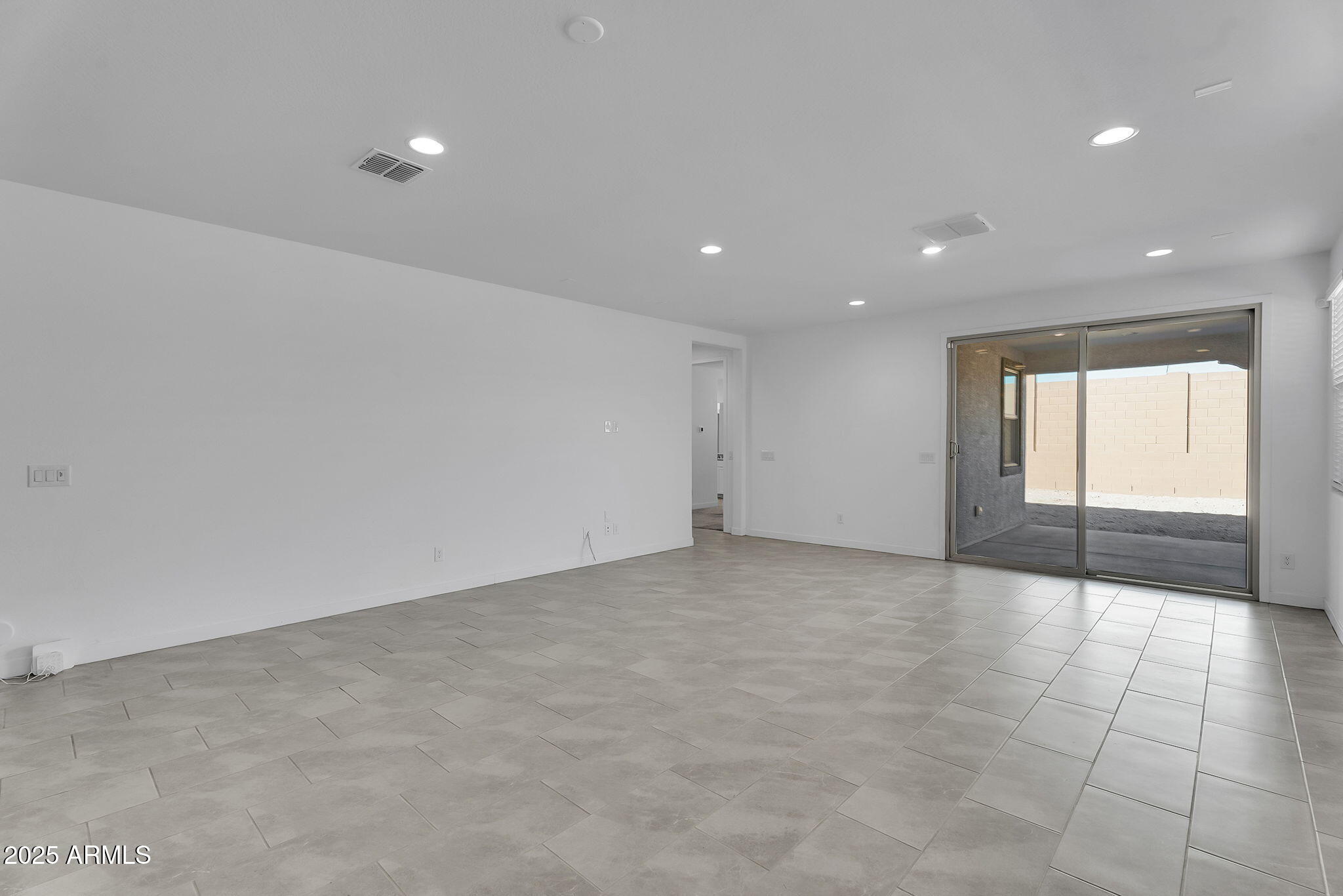 19948 West Flower Street Buckeye, AZ 85396 - Photo 11 of 58 a view of an empty room
