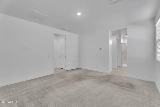 a view of empty room with windows