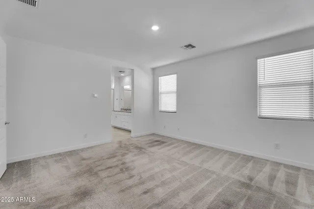 a kitchen with stainless steel appliances granite countertop a refrigerator a sink and a stove