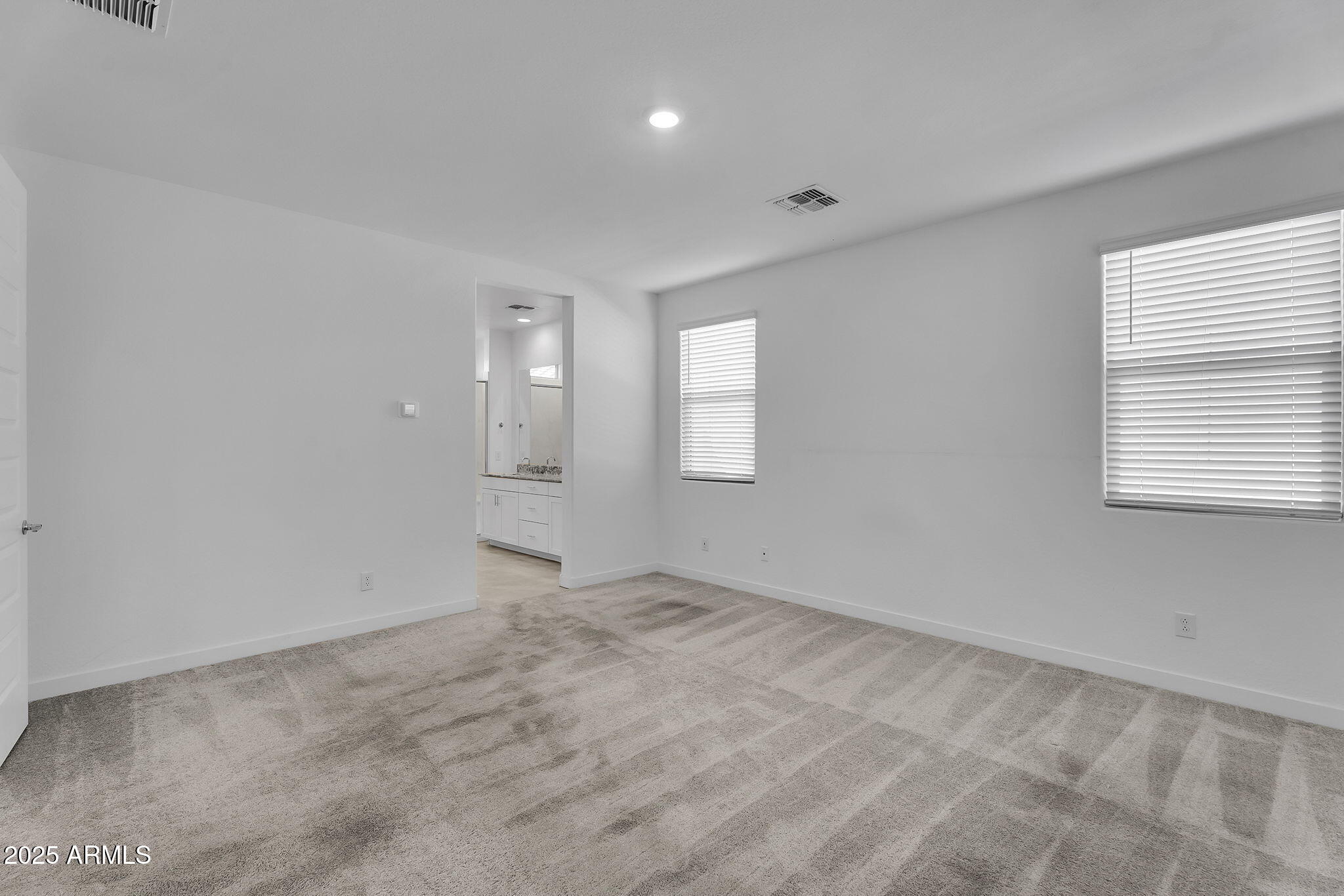 19948 West Flower Street Buckeye, AZ 85396 - Photo 14 of 58 a view of an empty room with a window