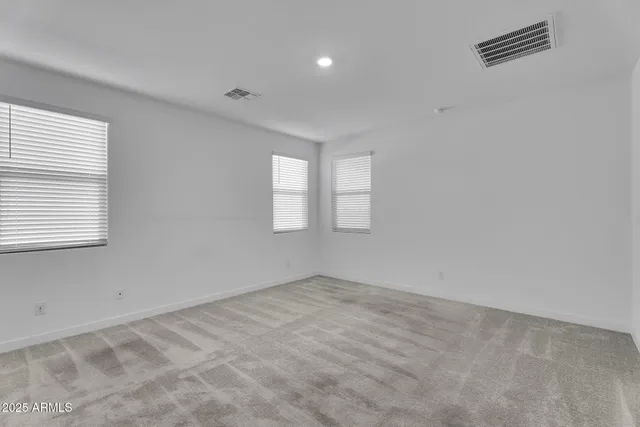 a kitchen with granite countertop a stove and a microwave