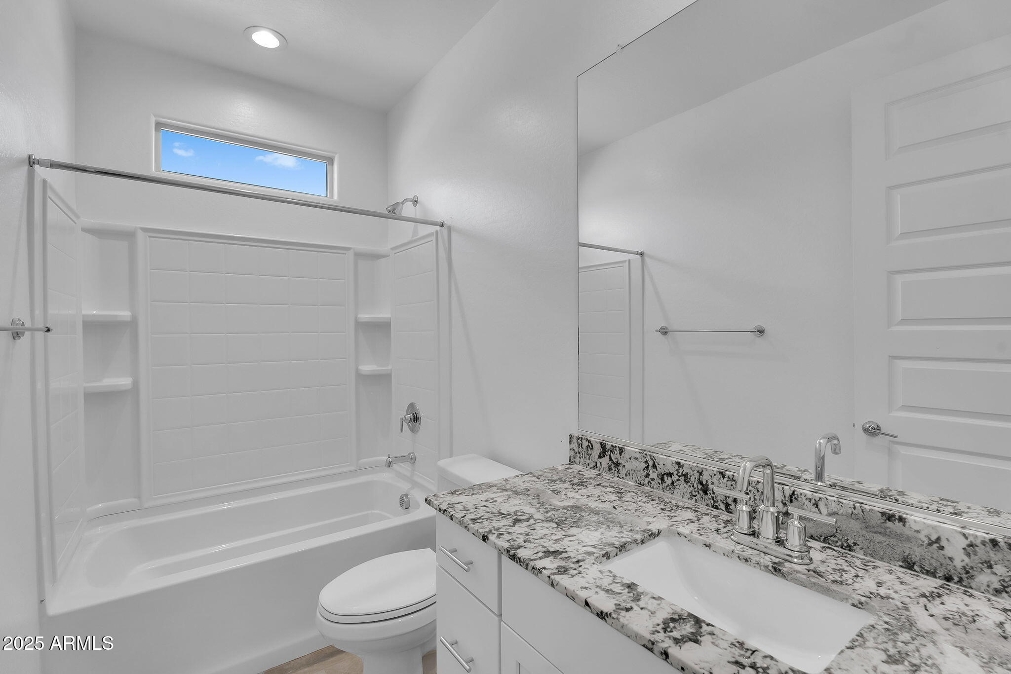 19948 West Flower Street Buckeye, AZ 85396 - Photo 27 of 58 a bathroom with a granite countertop sink toilet and shower