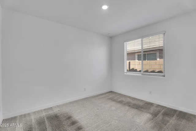 a bathroom with a shower sink and mirror