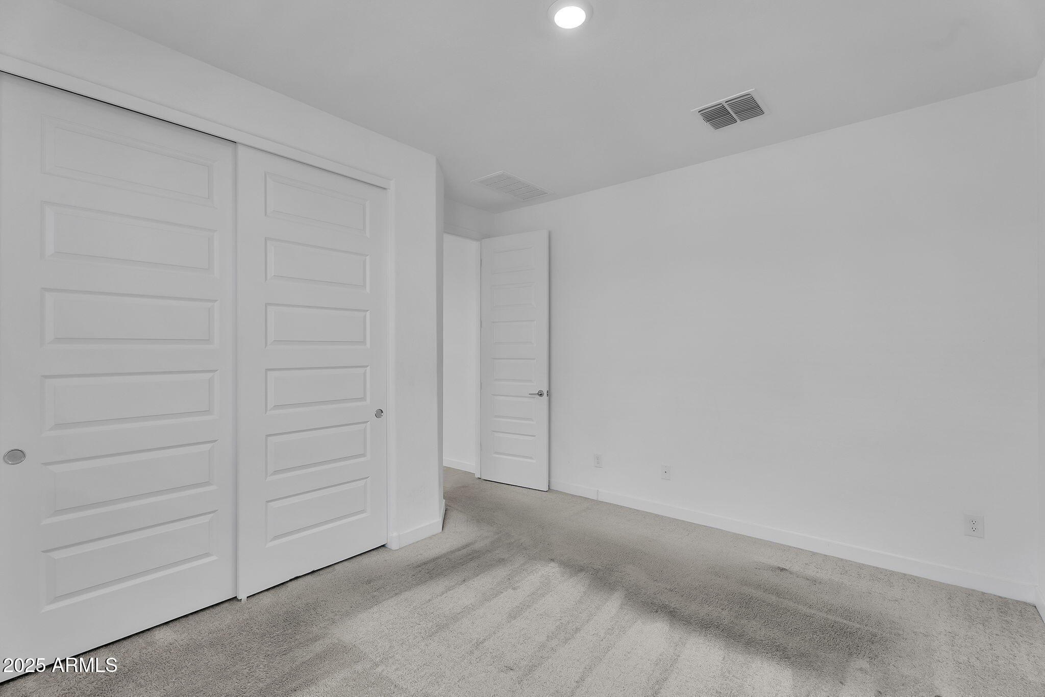 19948 West Flower Street Buckeye, AZ 85396 - Photo 29 of 58 an empty room with cabinet