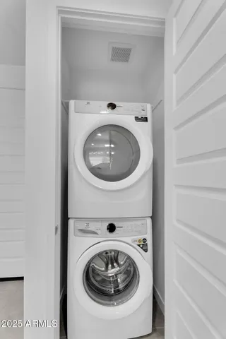 a view of an empty room with glass door