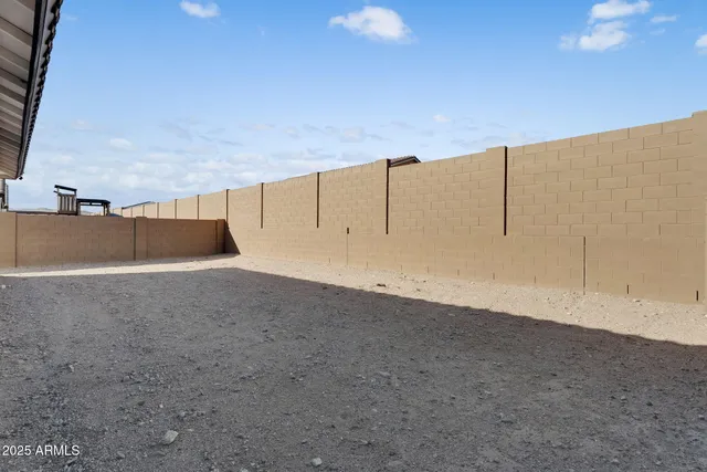 an aerial view of residential houses and car parked on the street side