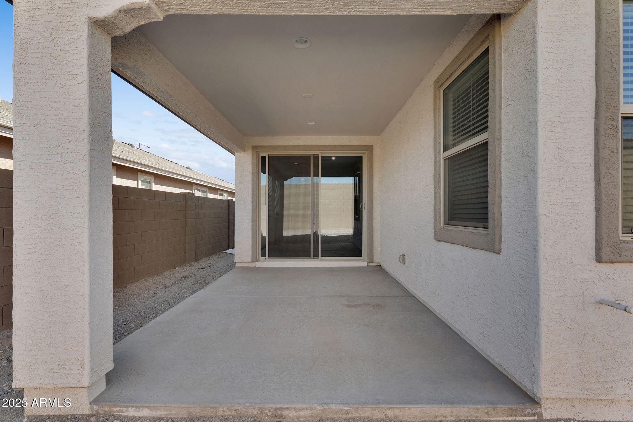 19948 West Flower Street Buckeye, AZ 85396 - Photo 46 of 58 a view of an empty room with glass door