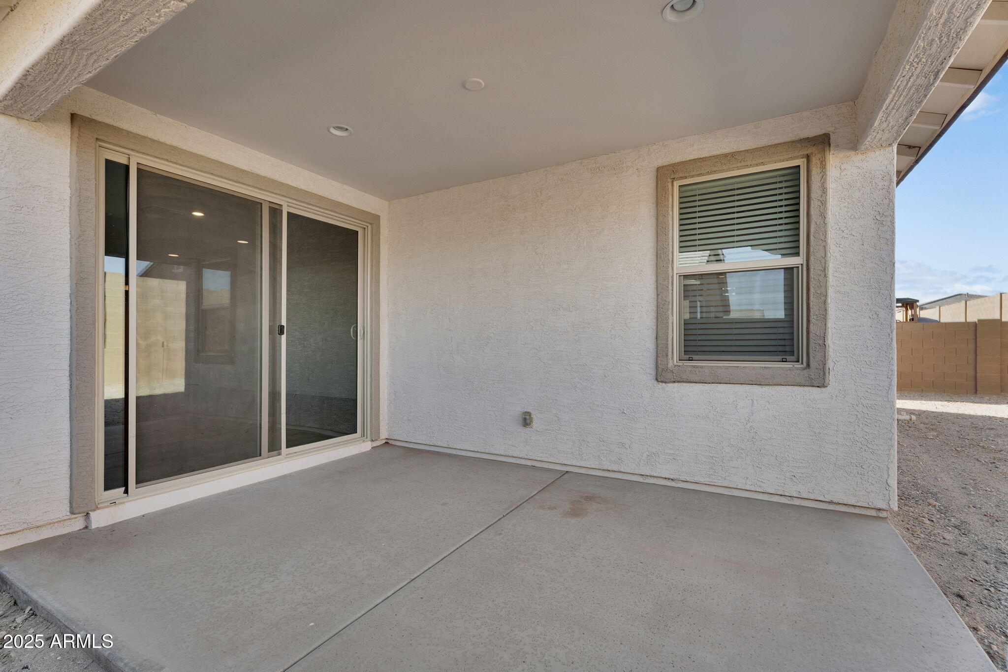 19948 West Flower Street Buckeye, AZ 85396 - Photo 47 of 58 an empty room with windows and closet