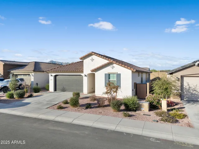 an aerial view of a house with a mountain view