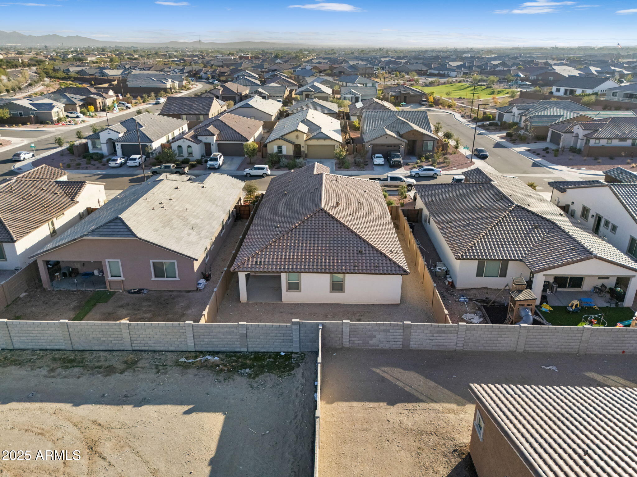 19948 West Flower Street Buckeye, AZ 85396 - Photo 54 of 58 an aerial view of a house with a mountain view