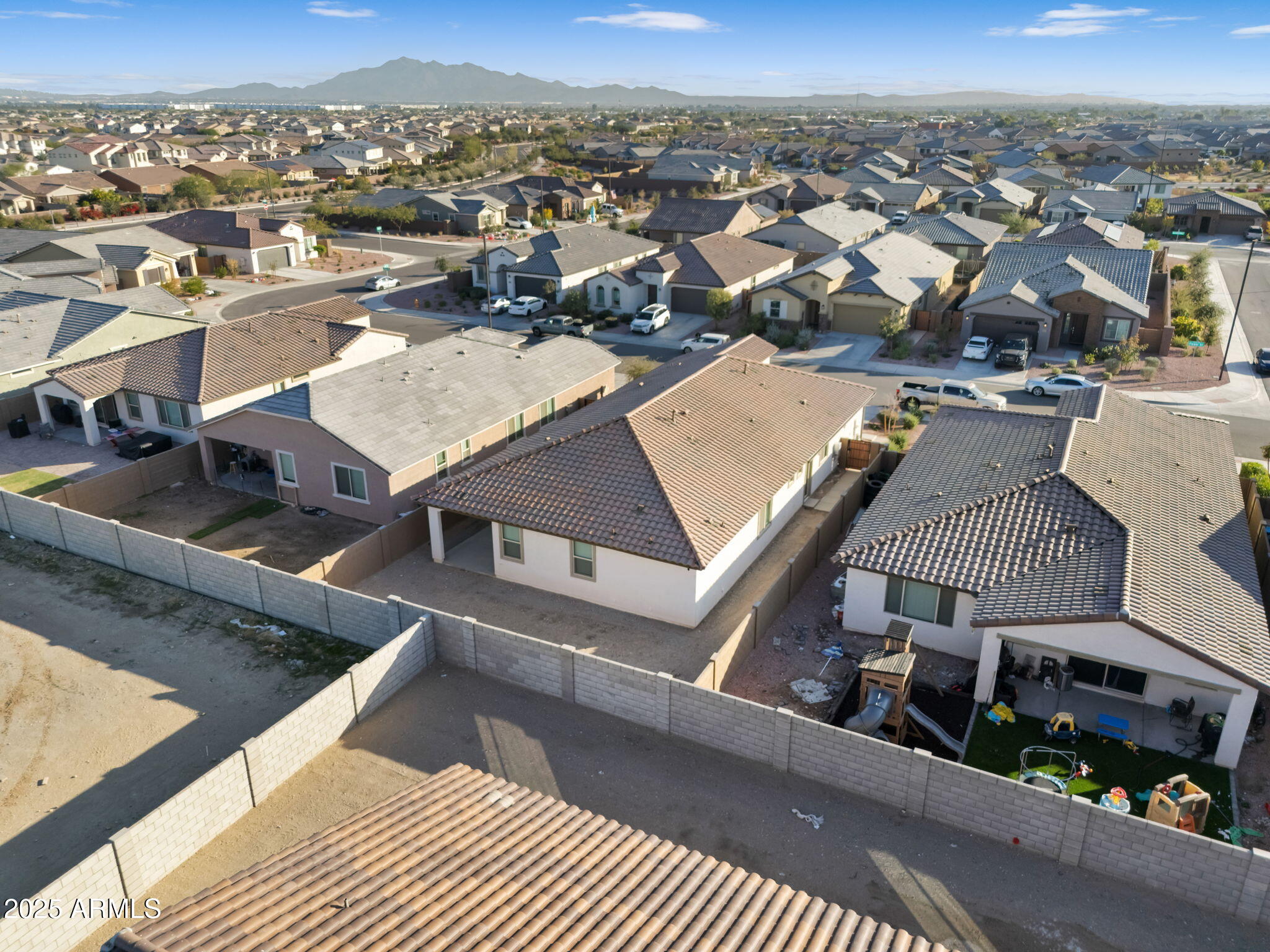 19948 West Flower Street Buckeye, AZ 85396 - Photo 56 of 58 an aerial view of a house with a mountain view