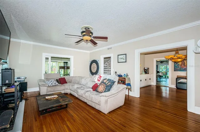 a kitchen with stainless steel appliances a sink cabinets and window