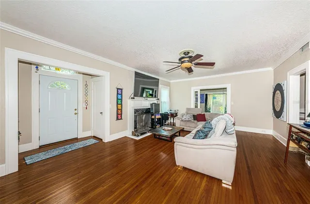 a view of a patio with table and chairs and potted plants