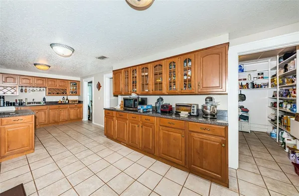a living room with a bed and a window