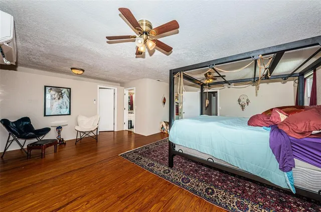 a kitchen with stainless steel appliances kitchen island granite countertop a refrigerator and a stove