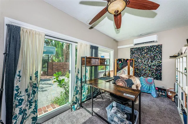 a kitchen that has a microwave and a stove