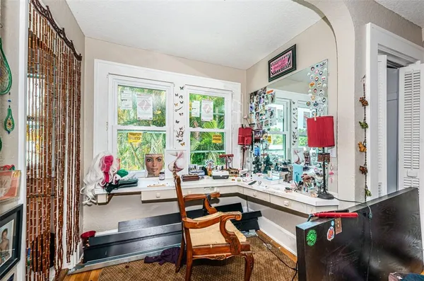 a living room with furniture and a floor to ceiling window