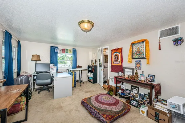 a view of yard with patio