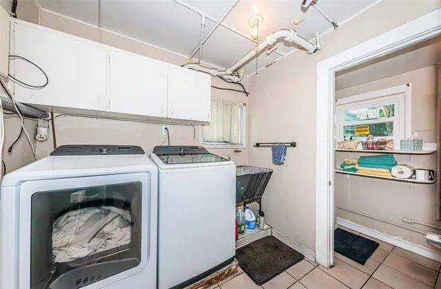 a view of a chair and table in the garden