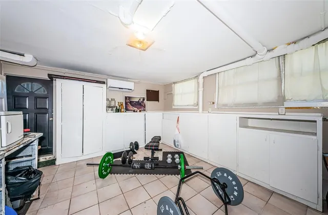 a view of a backyard with plants and a patio