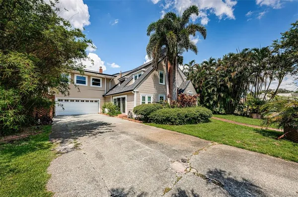 a view of a house with backyard space