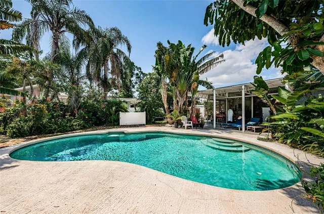 a kitchen with stainless steel appliances granite countertop a refrigerator and cabinets