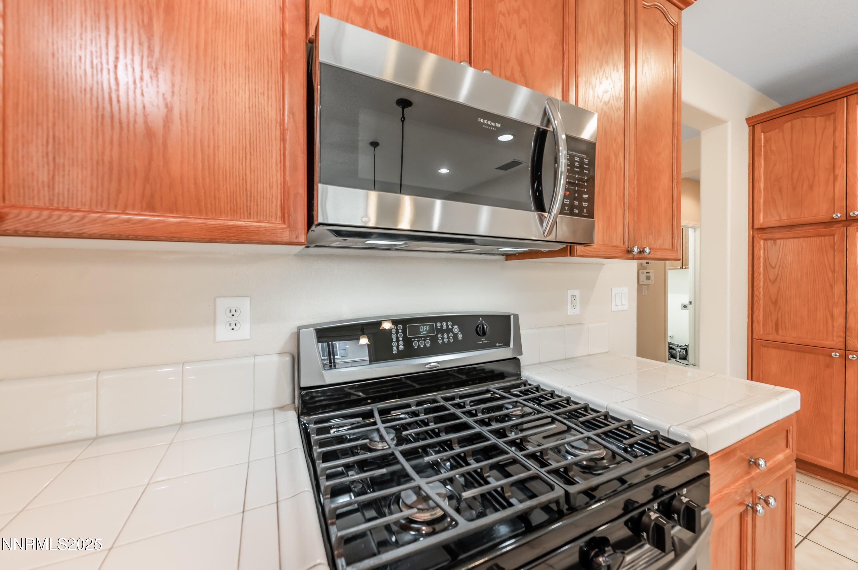 2180 Peaceful Valley Drive Reno, NV 89521 - Photo 13 of 31 a kitchen with granite countertop a stove and a sink