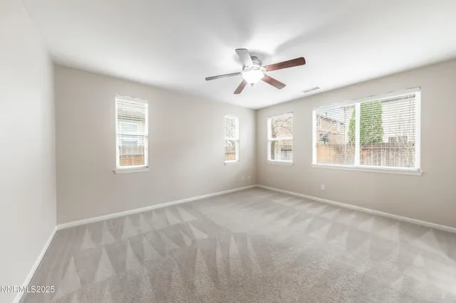 a view of empty room with windows