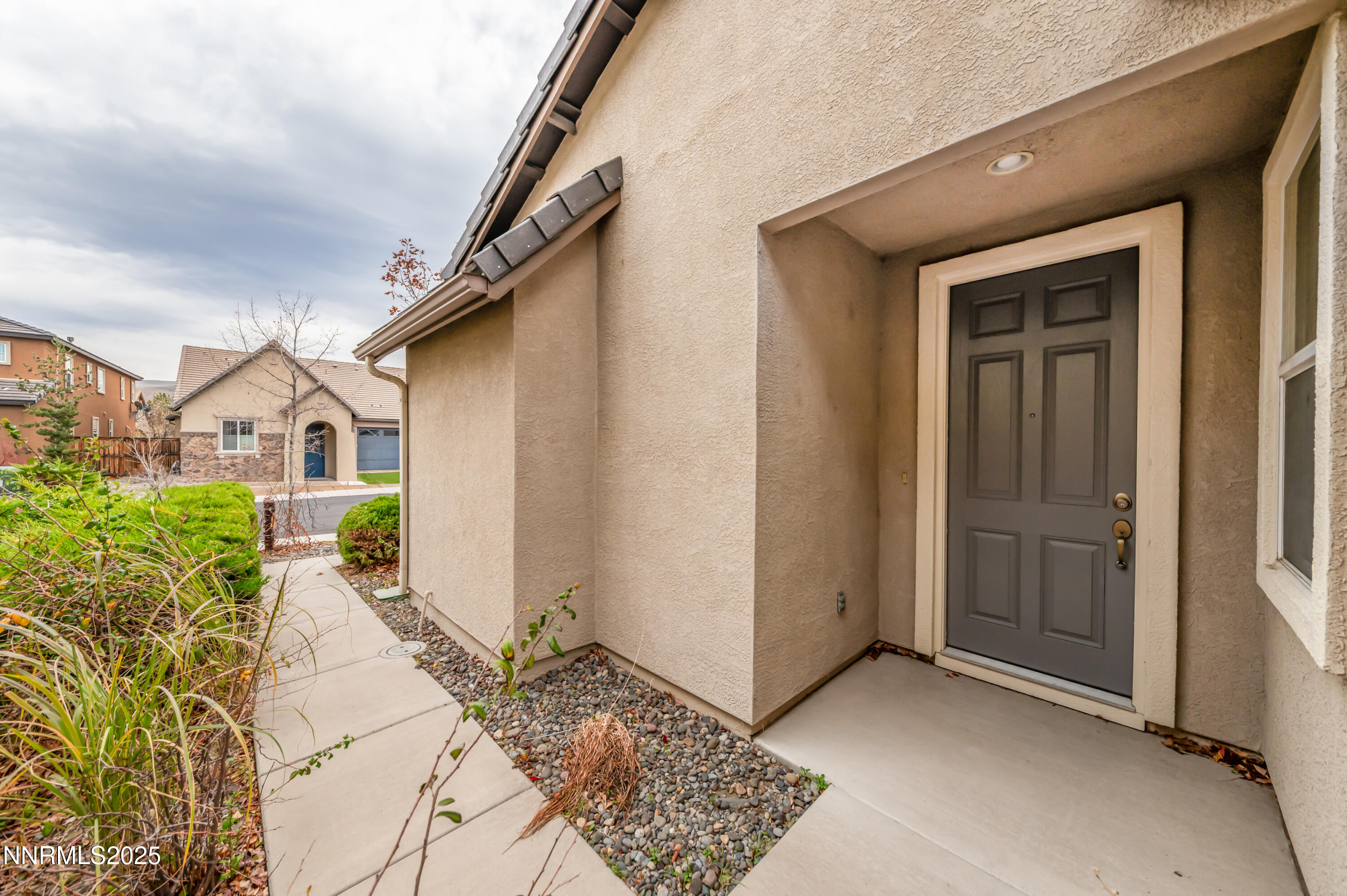 2180 Peaceful Valley Drive Reno, NV 89521 - Photo 3 of 31 a front view of a house with garden