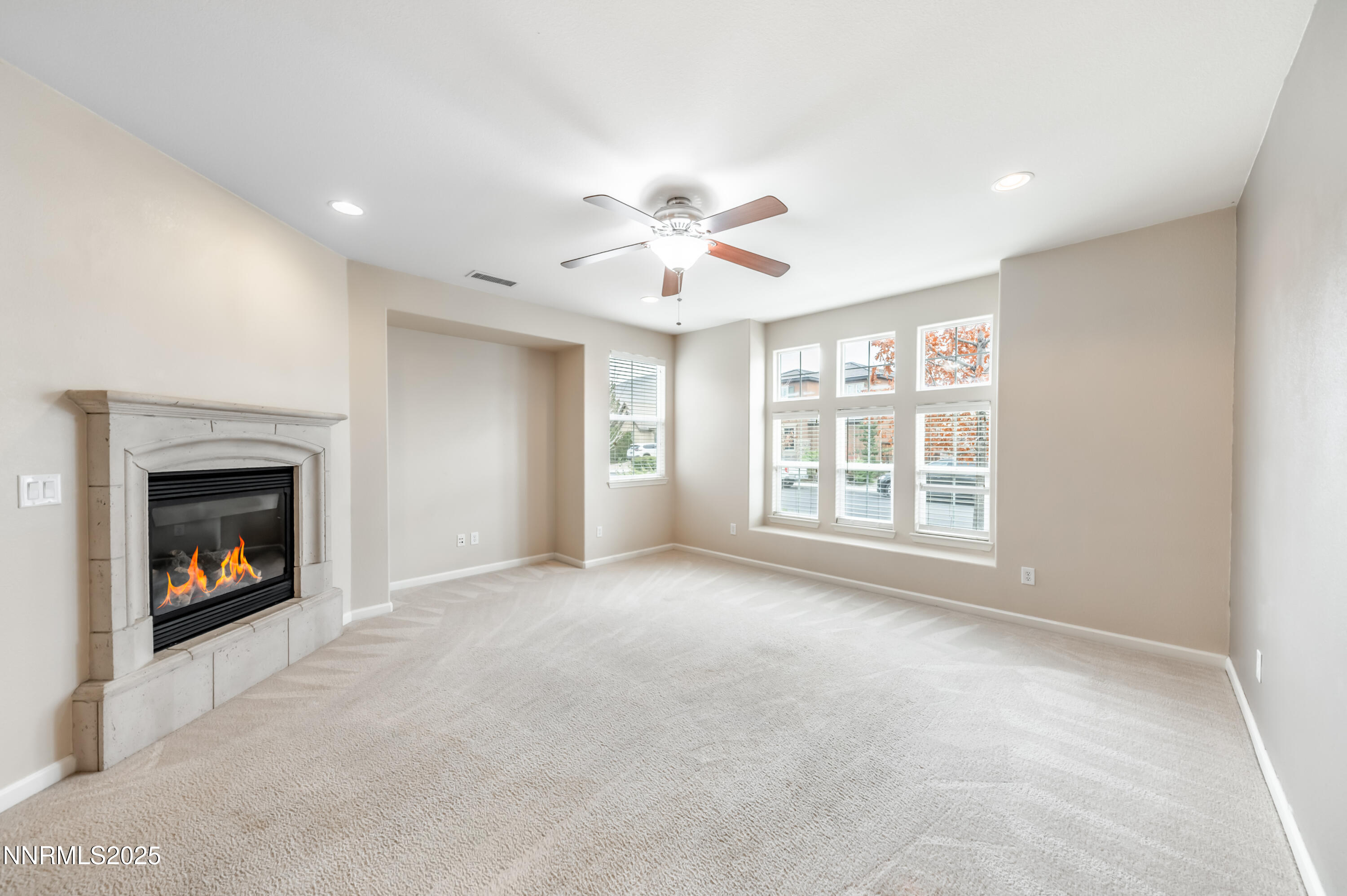 2180 Peaceful Valley Drive Reno, NV 89521 - Photo 5 of 31 an empty room with windows and fireplace