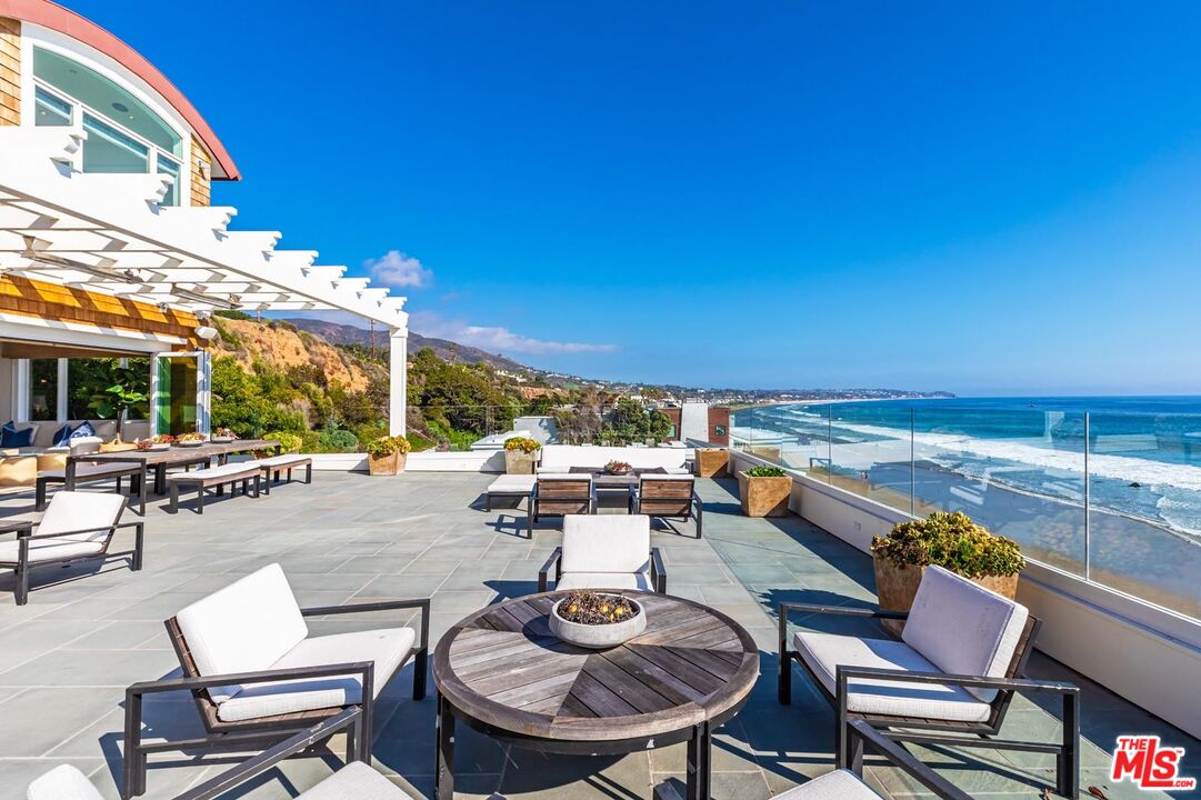 31412 Broad Beach Road Malibu, CA 90265 - Photo 11 of 32 a view of a patio with swimming pool table and chairs